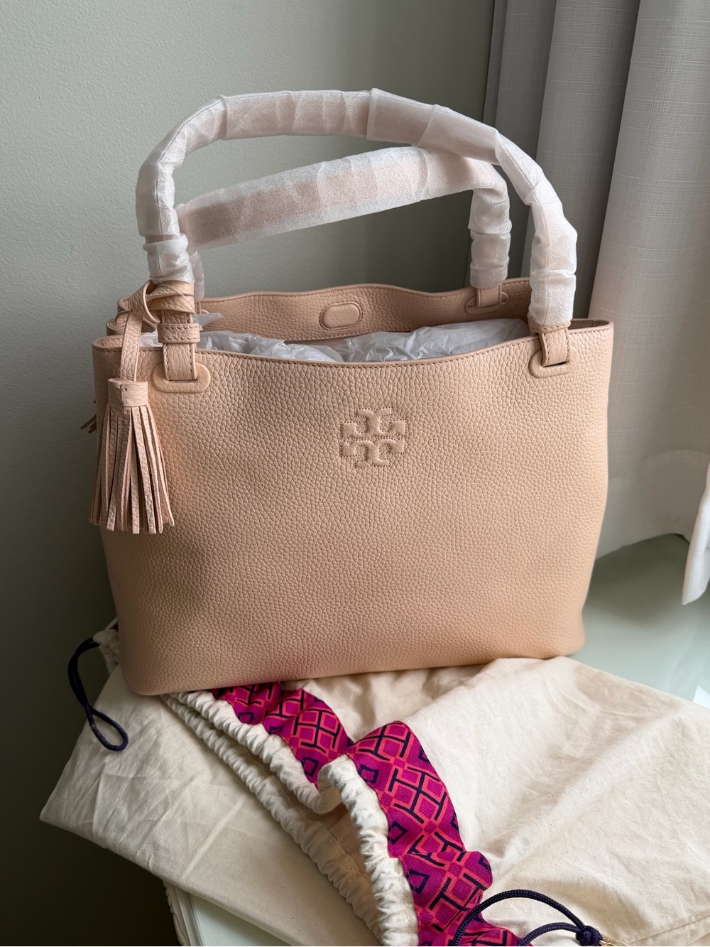 Tory Burch Pebbled shoulder bag in Blush Pink with tassel
